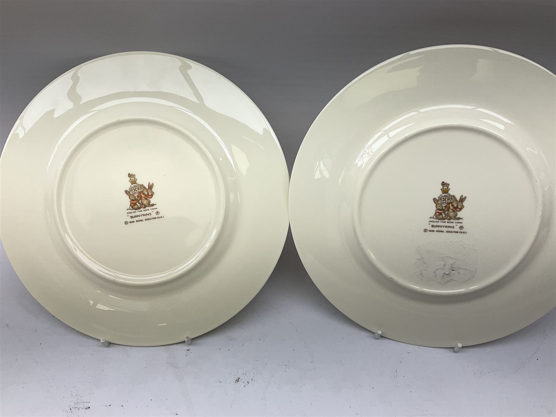 Royal Doulton Bunnykins ceramics, comprising two baby bowls, twin handled cup, two plates, money box, cup, bowl and spoon (9)