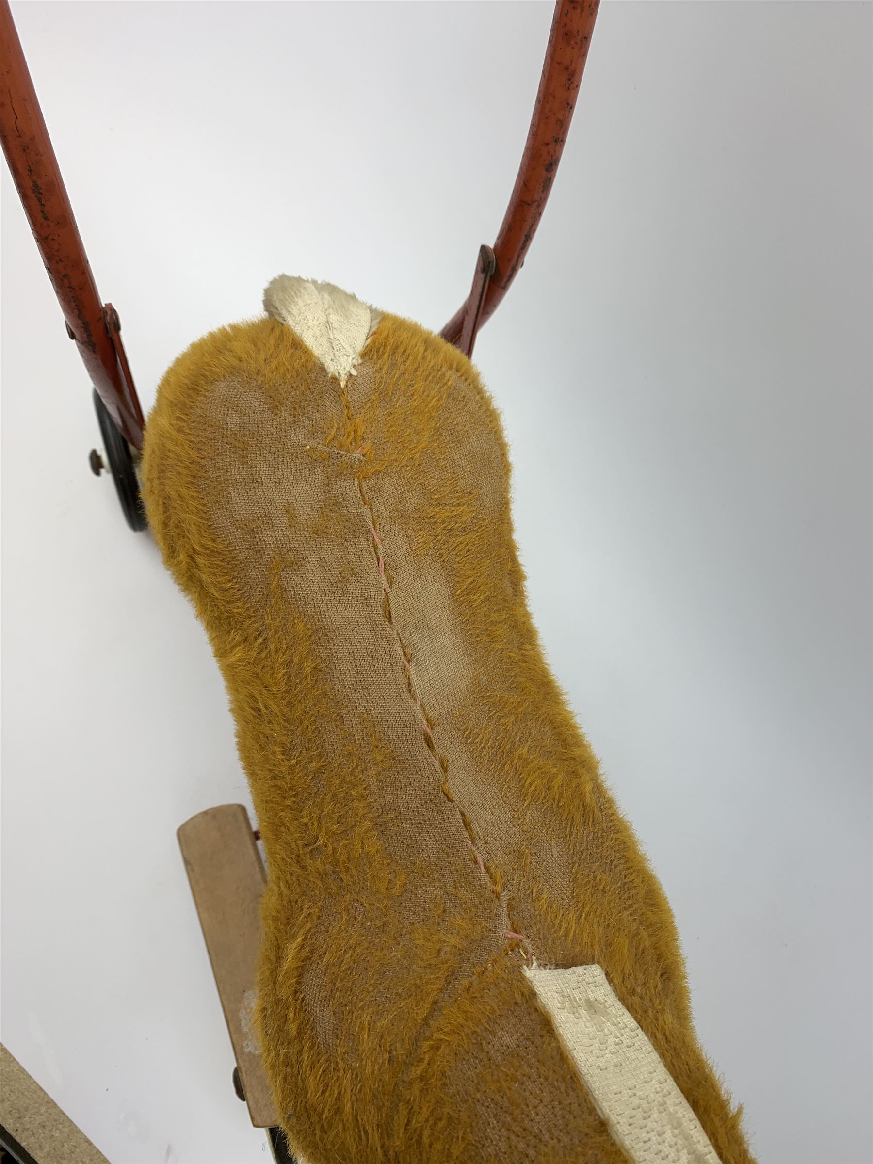 Pedigree push along plush covered horse 1950s-60s with red tubular metal framework and beech foot rests H25