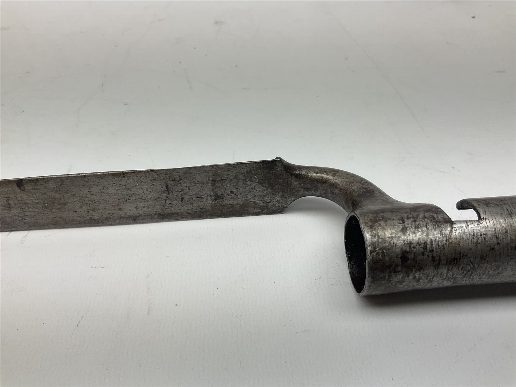British pattern 1876 socket bayonet with 55cm triangular blade; another smaller socket bayonet; and a leather shot flask, the brass action marked Sykes (3)