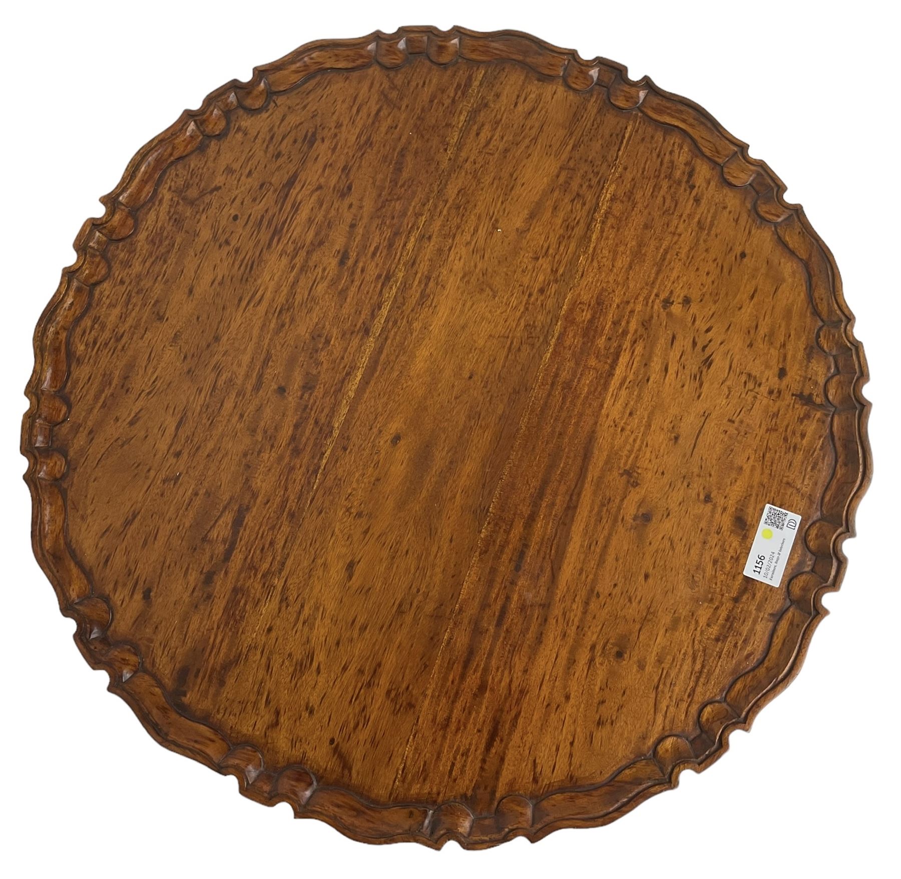 Georgian design hardwood tripod table, moulded pie-crust tilt-top, turned and fluted column carved with foliage, on three acanthus leaf carved splayed supports with ball and claw feet