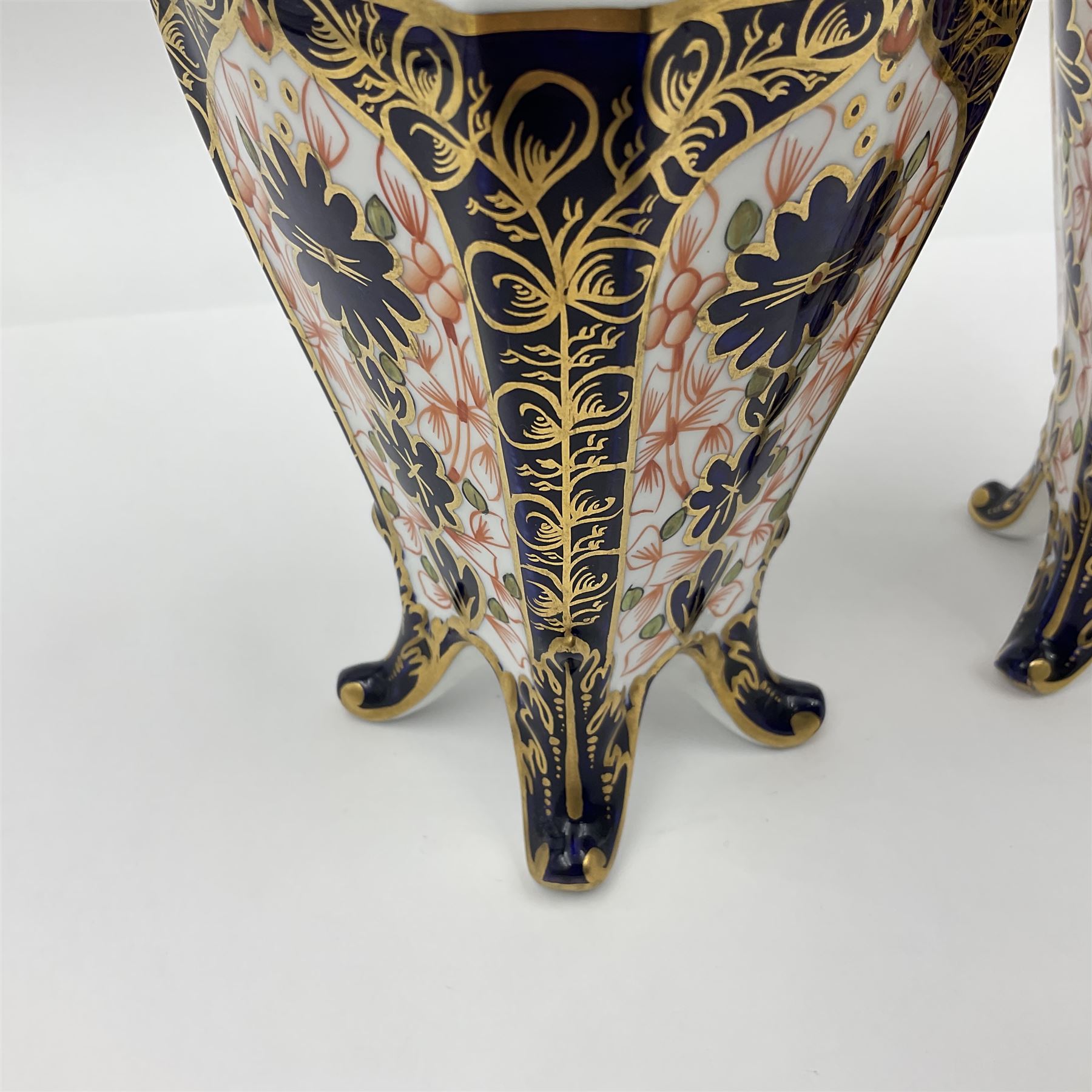 Pair of early 20th century Royal Crown Derby Imari 1128 pattern vases, of tapering straight sided form with waisted neck and frilled rim, upon four splayed feet, with printed and painted marks beneath including illustration date codes for 1911 and 1920, H17cm
