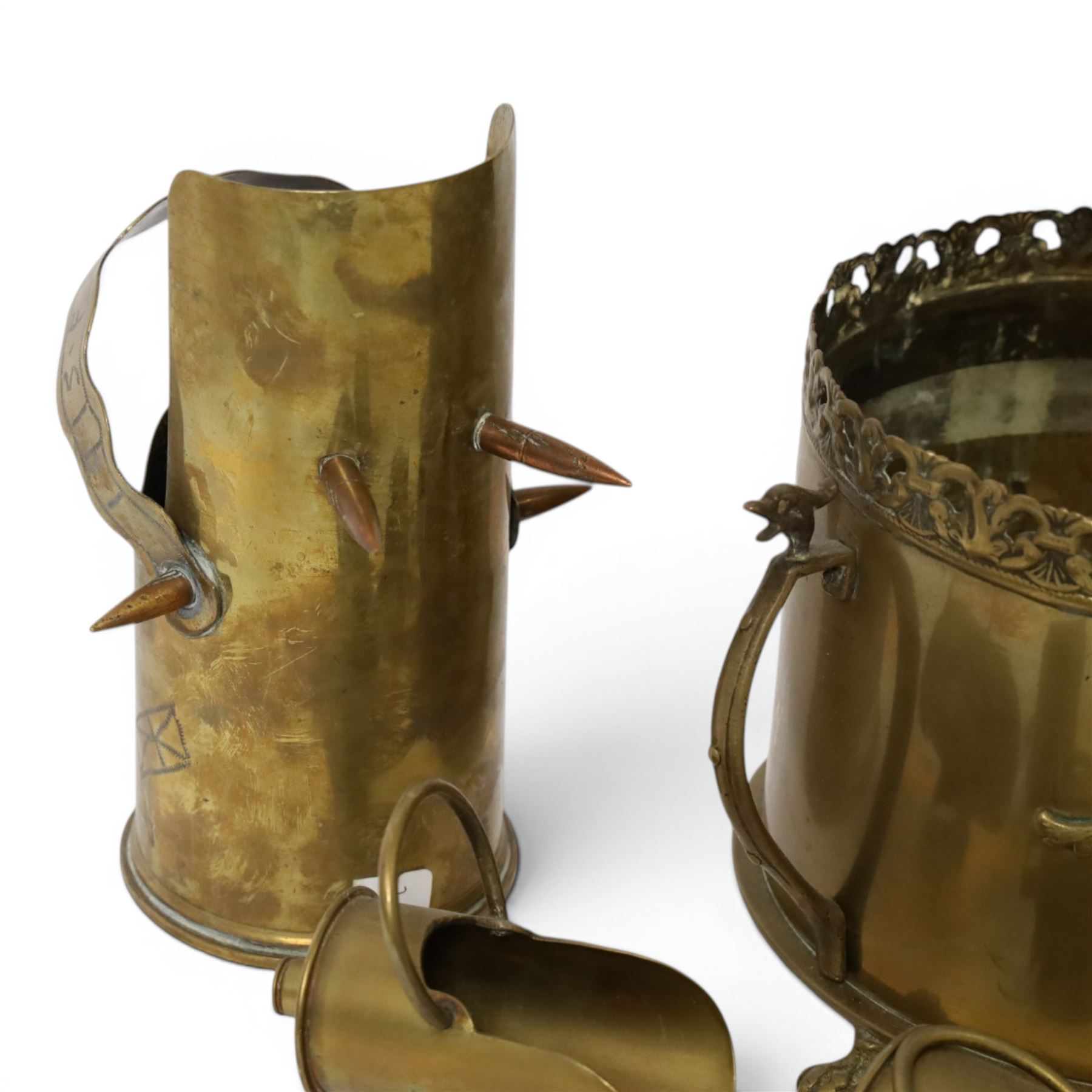 Trench Art shell case jardiniere, with pierced rim and paw feet, Jug marked The British General Hospital  January 1918 April 1919, seven miniature coal buckets and a sword   
