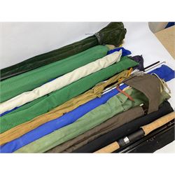 Twelve carbon fiber fishing rods in cloth covers, to include Normark fishing rod, Daiwa Carbon C98 etc (12)