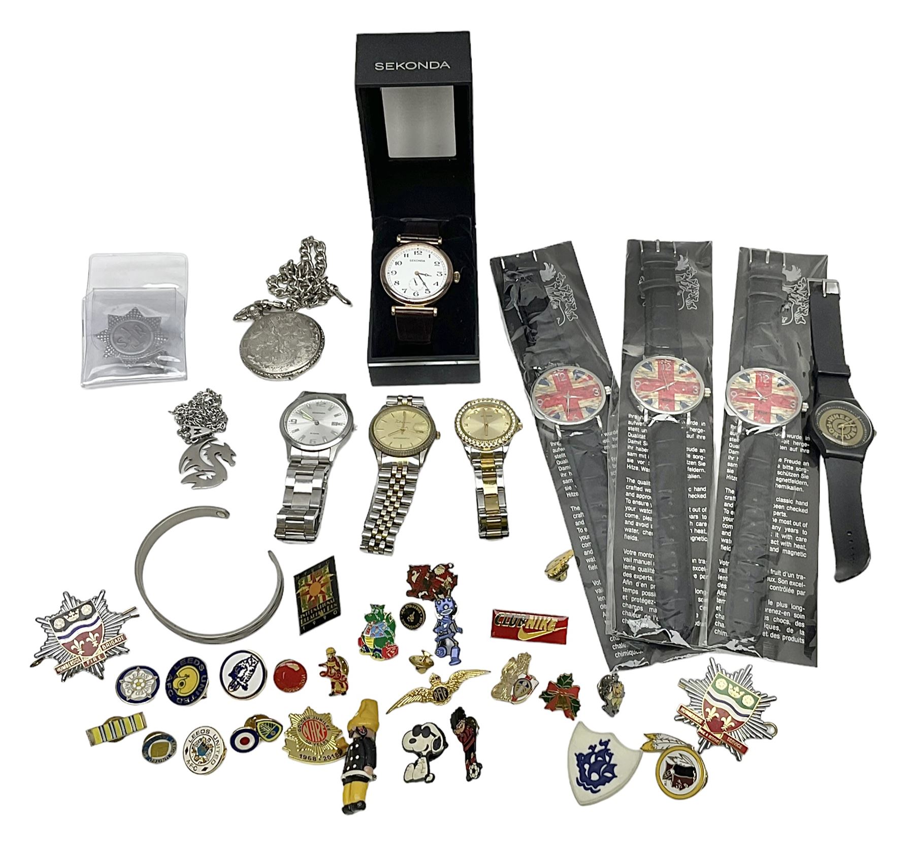 Three Sekonda wristwatches, together with other wristwatches, enamel badges and collectable badges