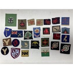 Approximately one-hundred printed and embroidered cloth badges including War Department Fleet Personnel, Air Formation Signals, HQ Northern Army Group, Commonwealth brigade, Iceland Force, 2nd, 4th, 5th, 6th, 7th, 8th, 9th and 11th Anti-Aircraft Divisions, East Africa Command, British Troops in Norway, 2nd Infantry, 44th, 47th, 48th, 49th, 50th, 55th, 56th, 59th, 61st, 78th Divisions etc