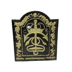 Cast iron fire back, cast with anchor, crown and rope maritime crest, foliage border, gilt and black finish