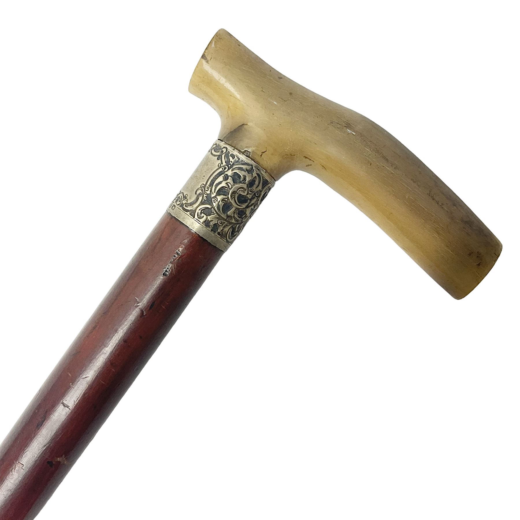 Victorian magician's cane, the mahogany walking stick twisting apart to reveal an internal mechanism, opening to tripod and black silk fold out magician's table, with horn handle and silver mount, hallmarked Birmingham 1891