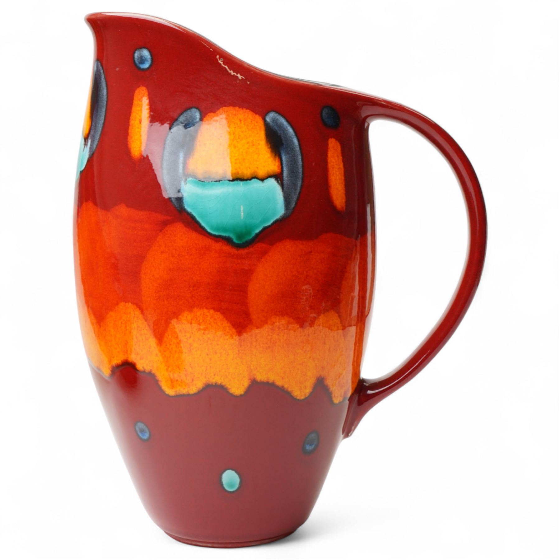 Four Poole pottery 'Volcano' pattern items comprising charger