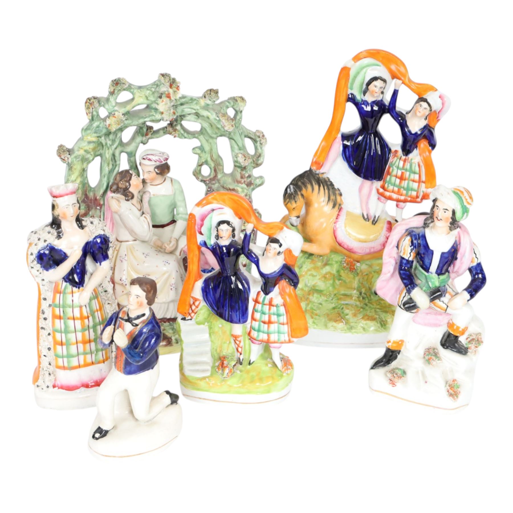 Six 19th century Staffordshire Theatre and Circus figures, comprising 
Mrs Siddons as Lady Macbeth, Conrad from Byron's Poem The Corsair, Madame Vestris as Paul from Paul and Virginia, arbour group by Thomas Parr, possibly depicting Lorenzo and Jessica from Shakespeare's Merchant of Venice, pair of circus trick riders on horseback, and smaller example featuring same pair, tallest example H26.5cm
