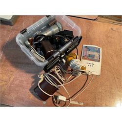 Two Singer sewing machines, model numbers 527 and 457, together with various Singer sewing machine parts, and a selection of sewing related accessories, to include threads, sewing needles, etc.