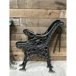 Four pairs of ornate cast iron bench ends (8)