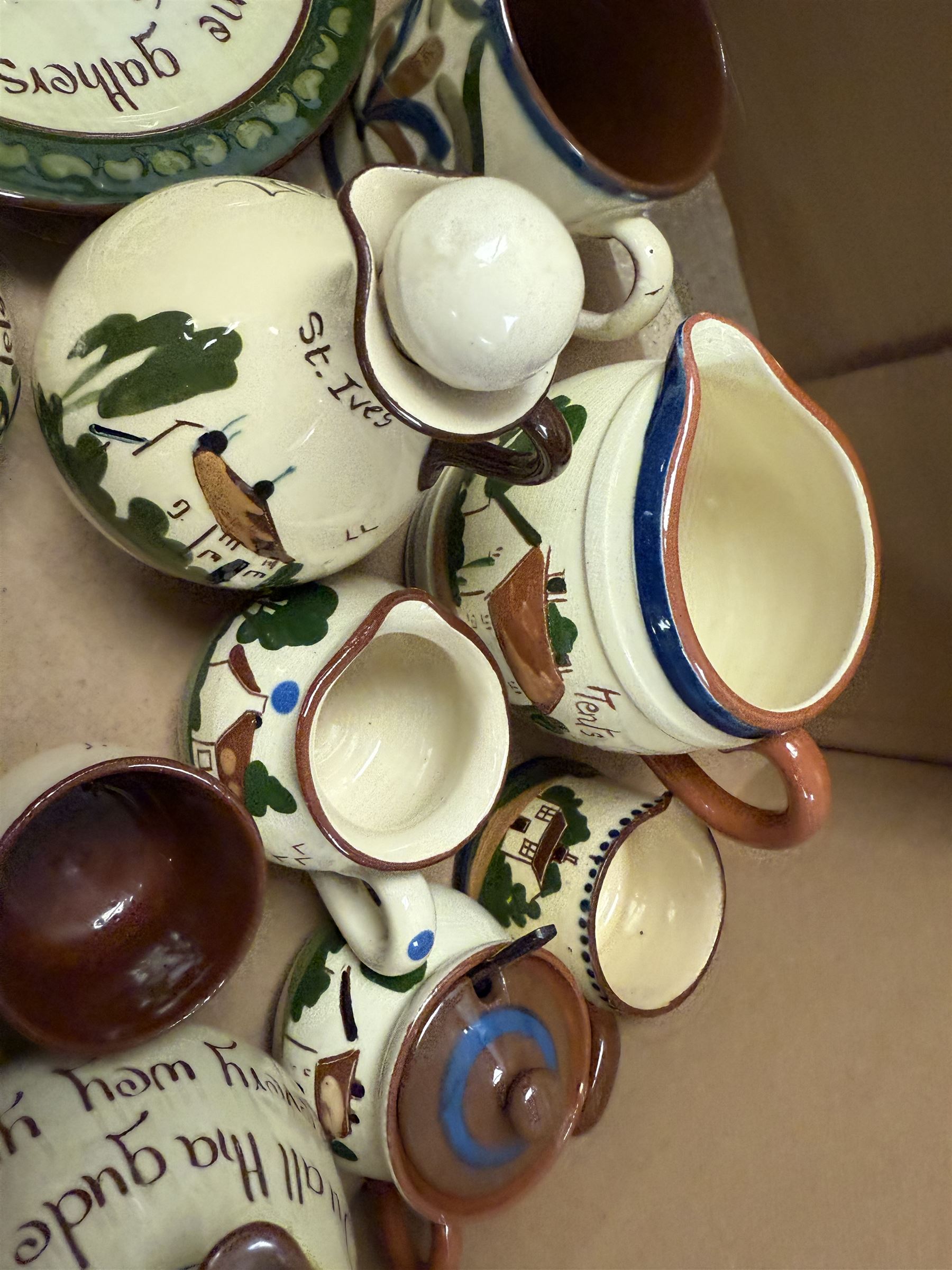 Collection of Torquay and similar Motto ware, including jugs, candlesticks, twin handled mug etc 