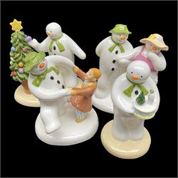 Four Coalport Characters The Snowman figures, comprising Snowman's Surprise, Christmas Cheer with certificate, The Bashful Blush and Dancing at the Party, all with original boxes 