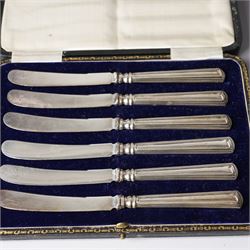 Cased set of twelve silver coffee spoons with bead knop terminals Birmingham 1910 Maker S W Smith & Co and two cases, each containing six silver handled pastry knives