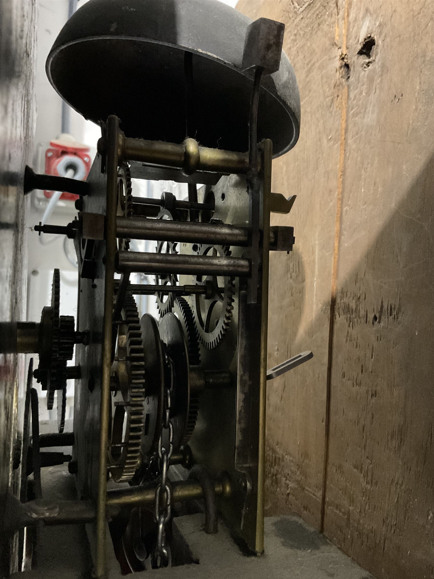 Michael Johnson of Barnard Castle (Yorks) - 30hr oak cased longcase clock c1820, with a swan necked pediment and central finial, break arch hood door flanked by turned pilasters, trunk with canted corners and a long door with a concave shaped top, on a rectangular plinth with a shaped base, painted dial with Arabic numerals, makers name, brass stamped hands and date aperture, countwheel striking, chain driven movement striking the hours on a bell.