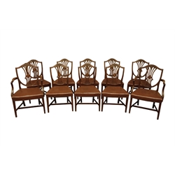  Set ten (8+2) early 20th century Hepplewhite style mahogany dining chairs with shield shaped Wheatsheaf and pierced backs, moulded square tapering supports with cross stretchers, studded leather seats, with 'Handmade Furniture Trade Mark' label   