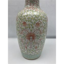 Large Chinese vase of baluster form with foliate decoration upon a white ground, H45cm  