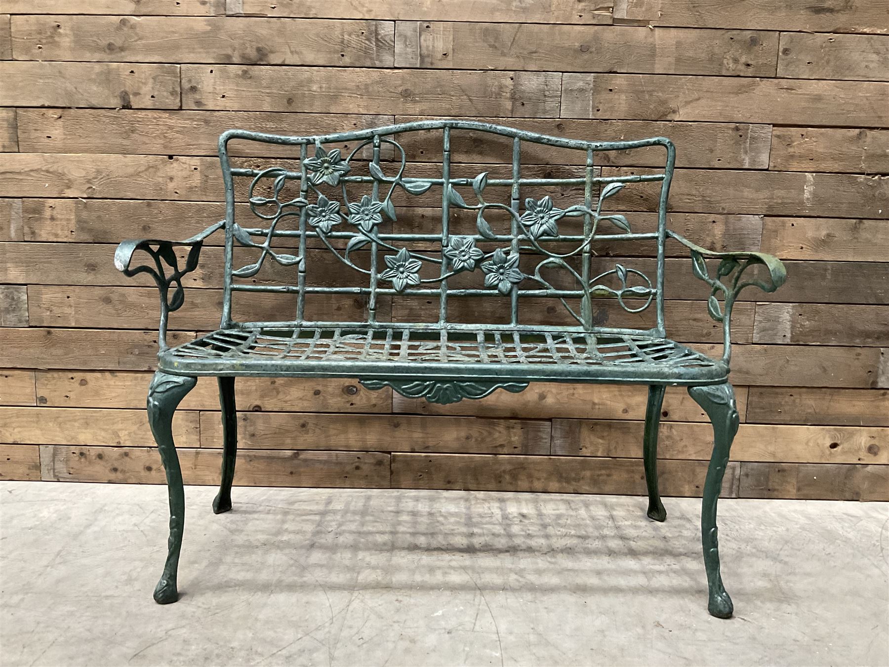 Cast aluminium garden dining set, comprising ornate circular table (D91cm, H68cm) a two seater bench, on cabriole supports (W118cm, H93cm, D55cm), and two matching armchairs (W55cm, H95cm, D54cm)