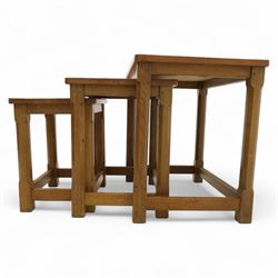 David 'Oakleafman' Langstaff - oak nest of three tables, each with a rectangular adzed top, with signature leaf motif on the bottom stretcher, from the workshop of David Langstaff, Easingwold, Yorkshire