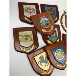 Various European cities and states, wooden heraldic shields each with hand painted raised shield including Baden Wurttemberg, Kunzelsau, City of London, Kingston upon hull etc, seventeen in total. . 