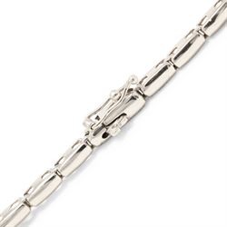 18ct white gold diamond necklace, bezel set with a single round brilliant cut diamond, spaced by two further diamonds, to a rectangular link necklace, London 2000, total diamond weight approx 0.75 carat