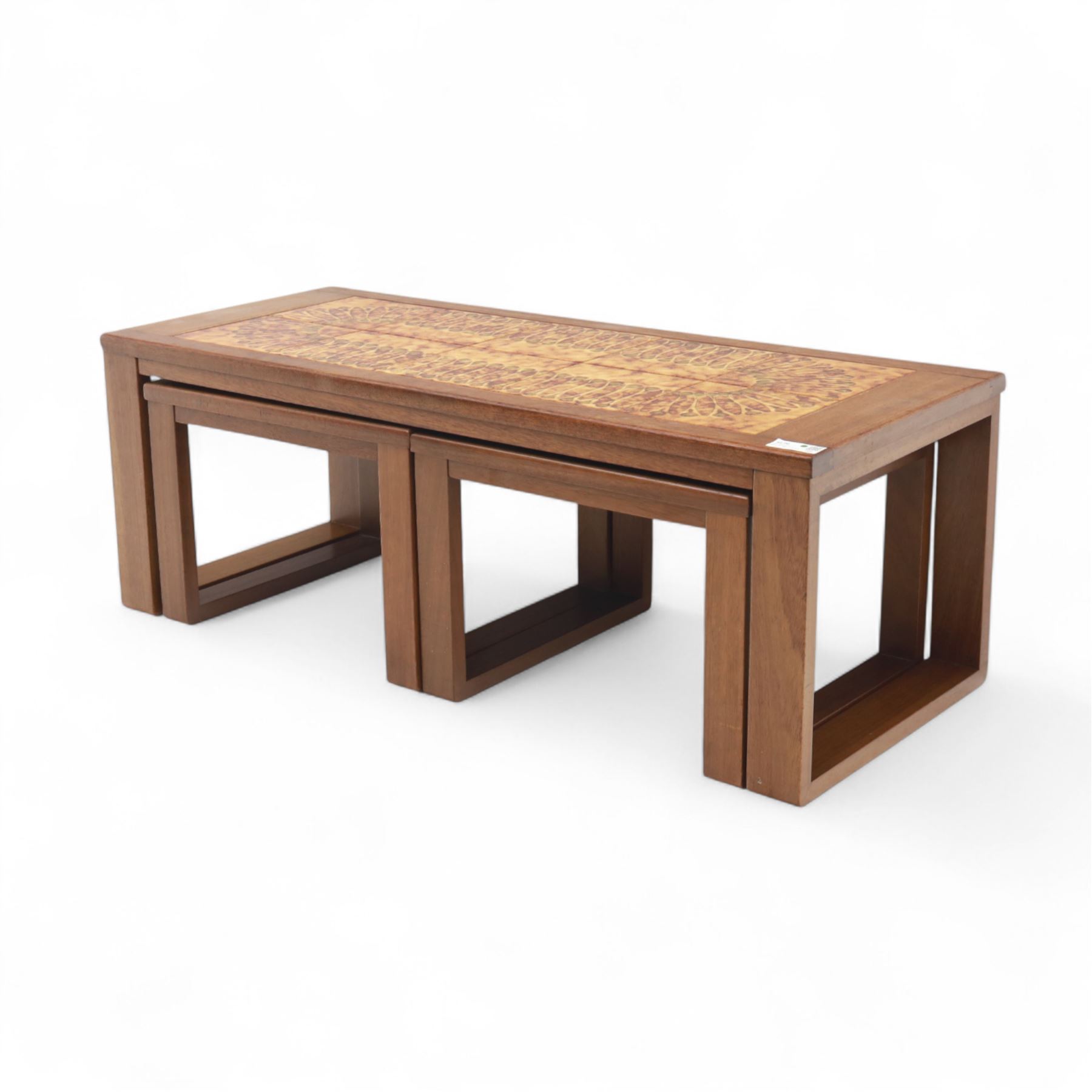 Mid-20th century ‘Long John’ teak nest of coffee tables, rectangular form with ceramic tile inset top, enclosing two smaller square tables with matching tile decoration