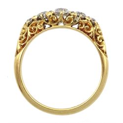 Early 20th century gold graduating five stone old cut diamond ring, with diamond accents set between, stamped 18ct, principal diamond approx 0.40 carat, total diamond weight approx 0.80 carat