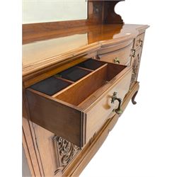 Late Victorian walnut mirror back sideboard or dresser, the raised back fitted with two curved and lead glazed cabinets, central arched bevelled mirror, the sideboard with break bowfront, fitted with six drawers and two cupboards, the cupboard doors panelled and carved with scrolls, shell and plant motifs, shaped apron with cabriole feet
