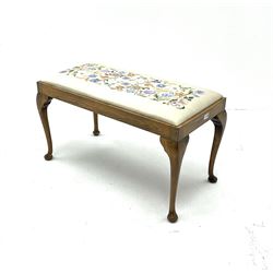 Window stool, seat upholstered in floral patterned fabric, shaped supports and pad feet