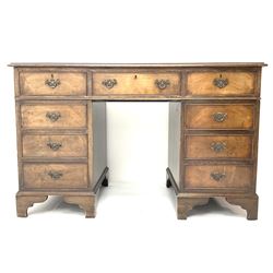 Late 20th century mahogany twin pedestal desk, rectangular moulded top with leather inset, fitted with nine drawers above bracket supports