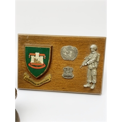 Six Phoenix World Reproductions bronzed figures of soldiers including Special Operations, Law firer, Jungle, radio carrier, Airborne etc, tallest H24cm; and oak Regimental plaque for 1st Bn The Devonshire and Dorset Regiment with strut support (7)