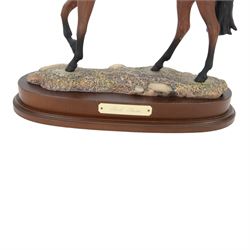 Two Royal Doulton horses, Desert Orchid and Red Rum, on wooden plinths 