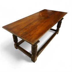 17th century revival oak refectory table, rectangular plank top above a scallop shell carved frieze and baluster turned legs carved with scallop shell and Gothic tracery, joined by stretchers