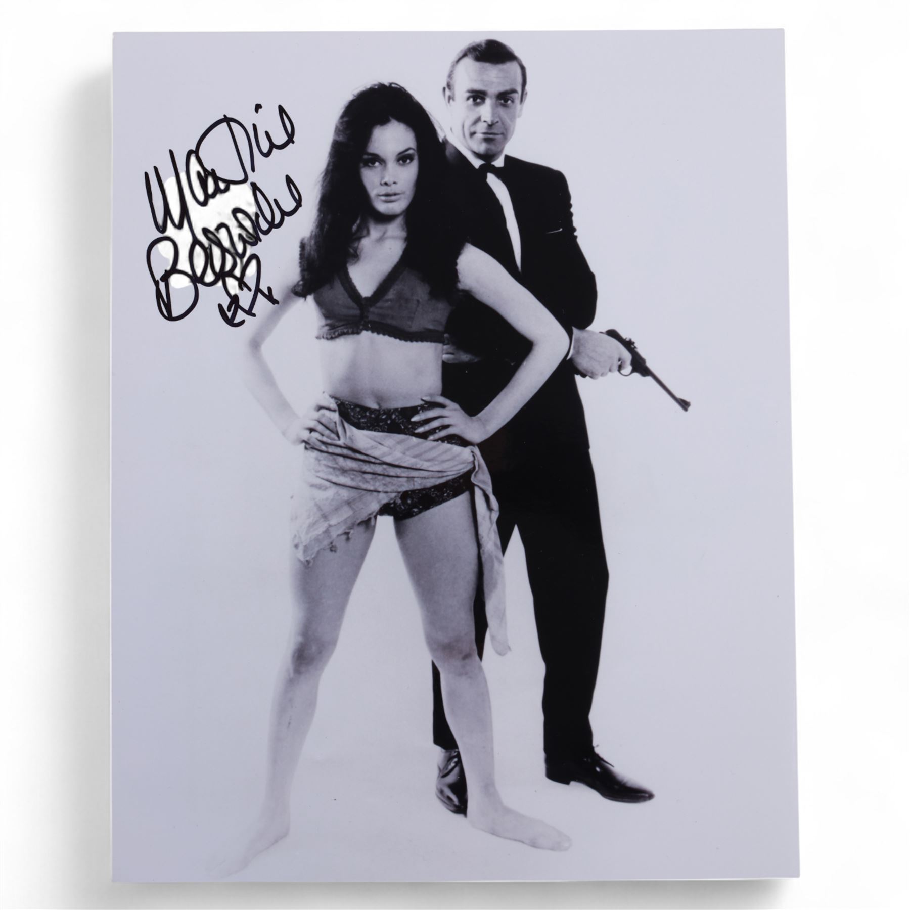 Eight James Bond signed 10 x 8