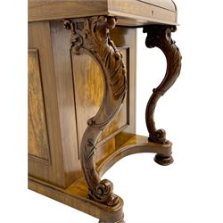 Fine and unusual 19th century olivewood piano top davenport, raised shaped back carved with olive branches and olives, the top hinges to reveal lidded and correspondence compartments, the piano lid enclosing sliding top with hinged and adjustable writing surface with leather inset, right-hand panelled door enclosing four drawers, olive branch and scroll carved cabriole front supports on moulded and shaped platform, turned cup feet with recessed castors 