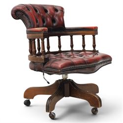 Captains swivel desk chair upholstered in oxblood leather, buttoned back and seat, shaped ...