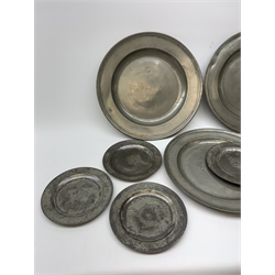 Collection of early 18th century pewter, comprising three large chargers, and seven plates, with various marks and touch marks verso, including the Crowned Rose and shield pseudo 'hallmarks', chargers D46cm and D42cm, plates D23cm.
