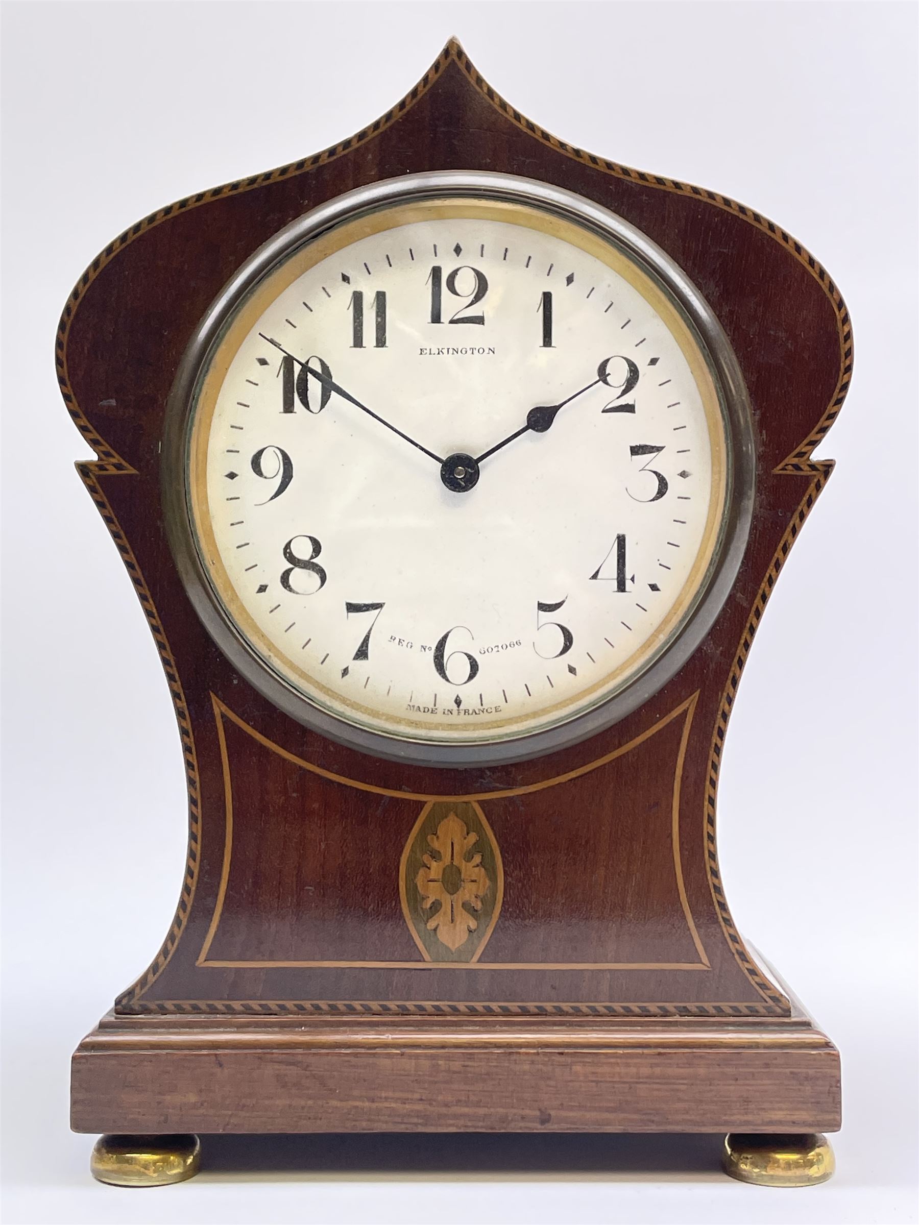 Edwardian inlaid mahogany mantel clock, pointed onion top and circular white enamel Roman dial signed 'Elkington', on brass feet 