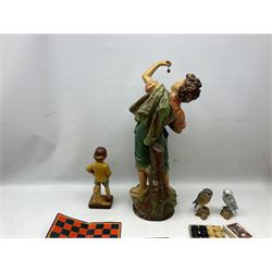 Early 20th Century continental plaster figure modelled as an eating cherry picker boy, H68cm, together with boxed dominos, owl figures, other games etc