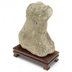 Chinese Western Han Dynasty (206BC–24AD) carved seated stone dog, stylized figure with upright ears and upraised squared snout, grey stone with weathered surface and tool marks visible to underside W13cm H16.5cm