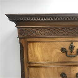 Early 19th century mahogany chest on chest, projecting Greek key cornice with two short and six long graduating drawers, canted blind fret corner, ogee supports, W124cm, H170cm, D57cm