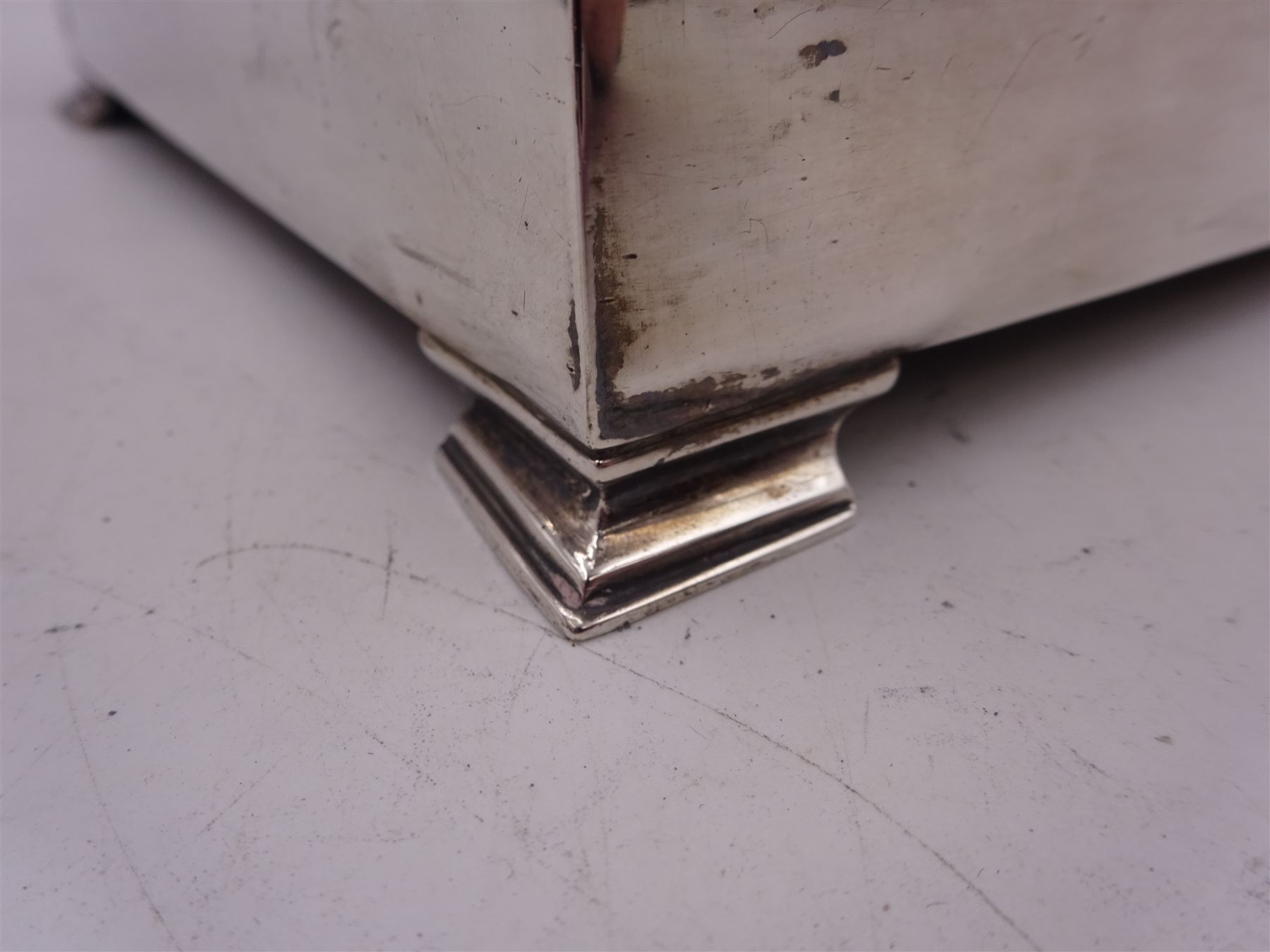 1920s silver mounted presentation cigarette box, of rectangular form, with engraved initials J.W.J and dated 1902-1927 to slightly domed hinged cover, opening to reveal compartmentalised softwood interior, upon four bracket feet, hallmarked Birmingham 1920, maker's mark worn and indistinct, H9cm, W23cm, reputedly given to John William Johnson, father of Amy Johnson,  famous for being the first long distance (to Australia) solo female pilot, and first female British grounds engineer, for his silver wedding anniversary