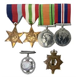 WW2 group of four medals comprising 1939-1945 War Medal, Defence Medal, Italy Star and 1939-1945 Star; with Royal Army Service Corps cap badge and RASC chrome and enamel sweetheart brooch