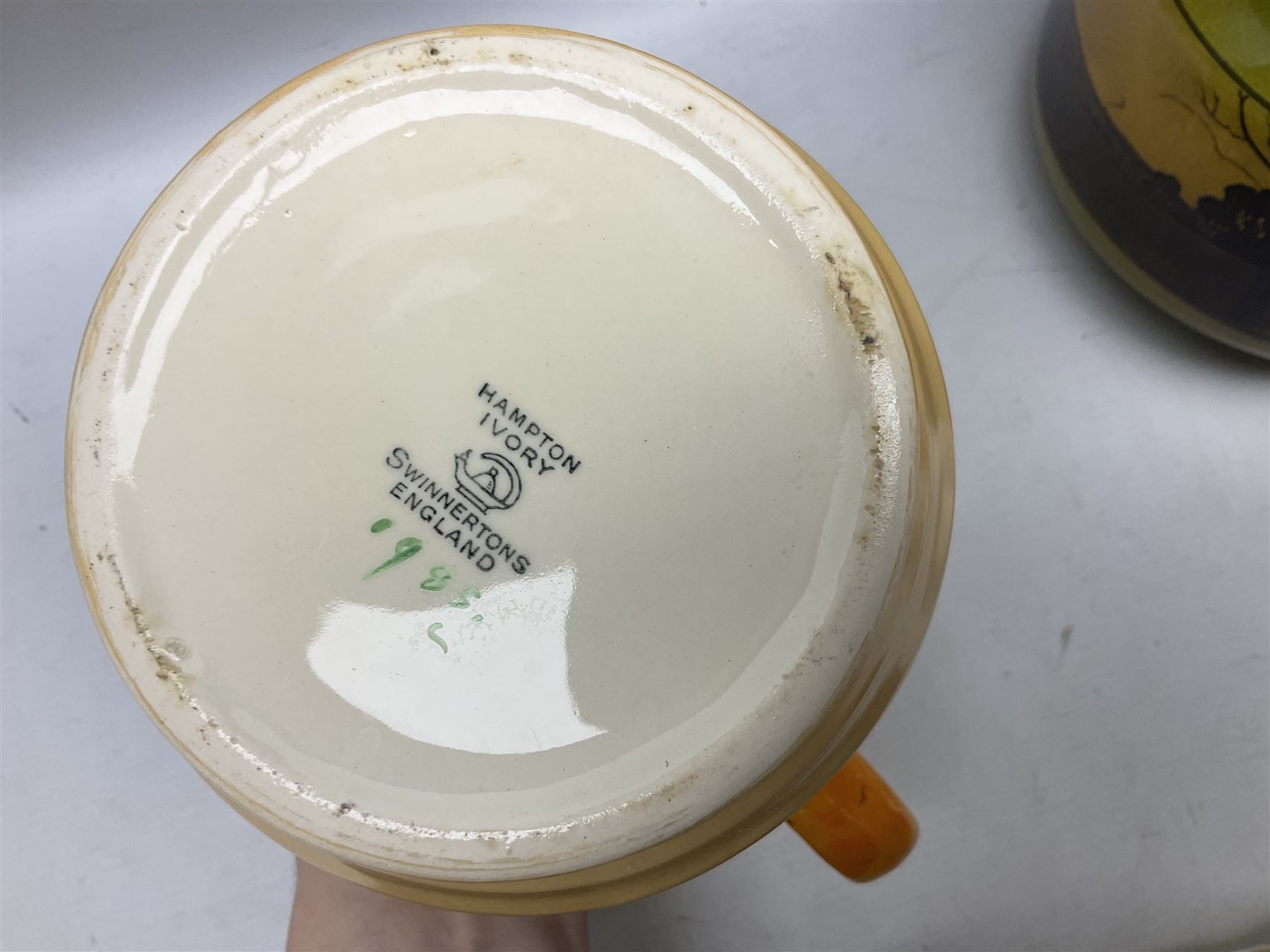 Royal Doulton wide rimmed jardinière, together with two Royal Doulton jugs, Arthur Wood jugs etc