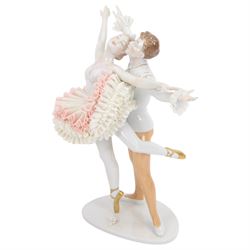 Unterweissbach lace figure, designed by K. Steiner, modelled as two ballerinas, the female figure with lace tutu, the male figure with lace cuffs, upon a shaped base with incised signature, with printed mark beneath, H26cm