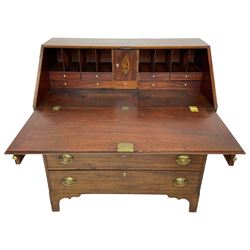 George III mahogany bureau, the fall-front banded and with boxwood stringing, enclosing fitted interior with pigeonholes and drawers surrounding a central cupboard with inlaid shell motif, the base with four graduating cock-beaded drawers, each with pressed brass handle plates with central lion masks and ivory escutcheons, on shaped bracket feet
This item has been registered for sale under Section 10 of the APHA Ivory Act