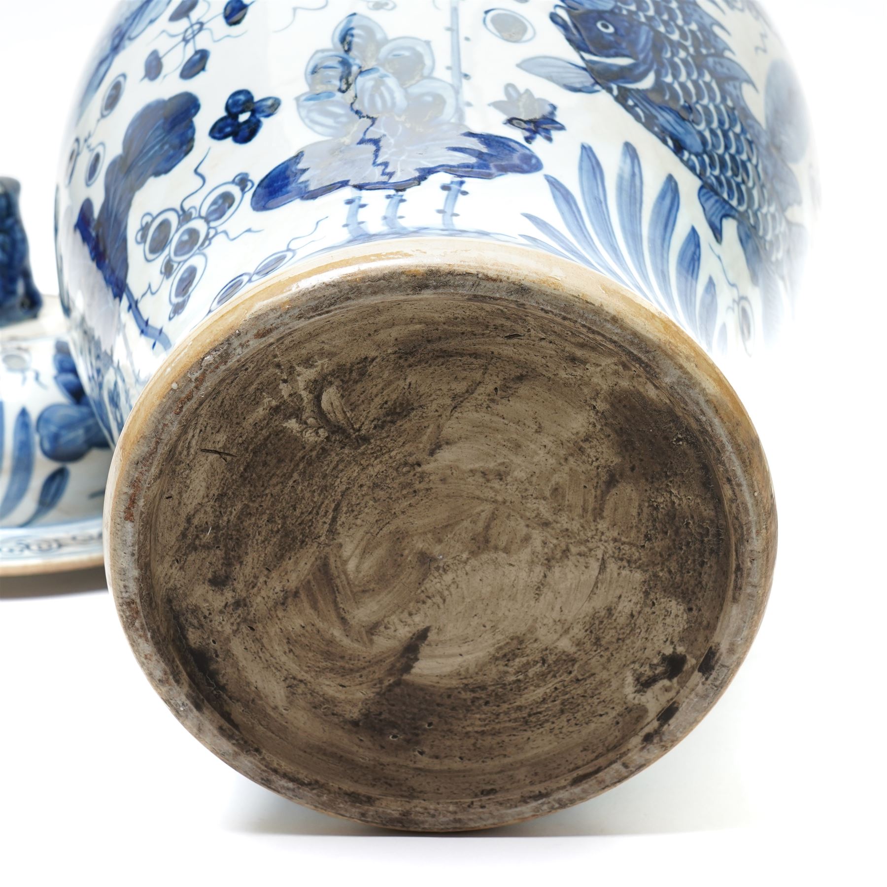 Pair of Chinese blue and white jars and covers, of baluster form, hand painted with fish and foliage, H50cm