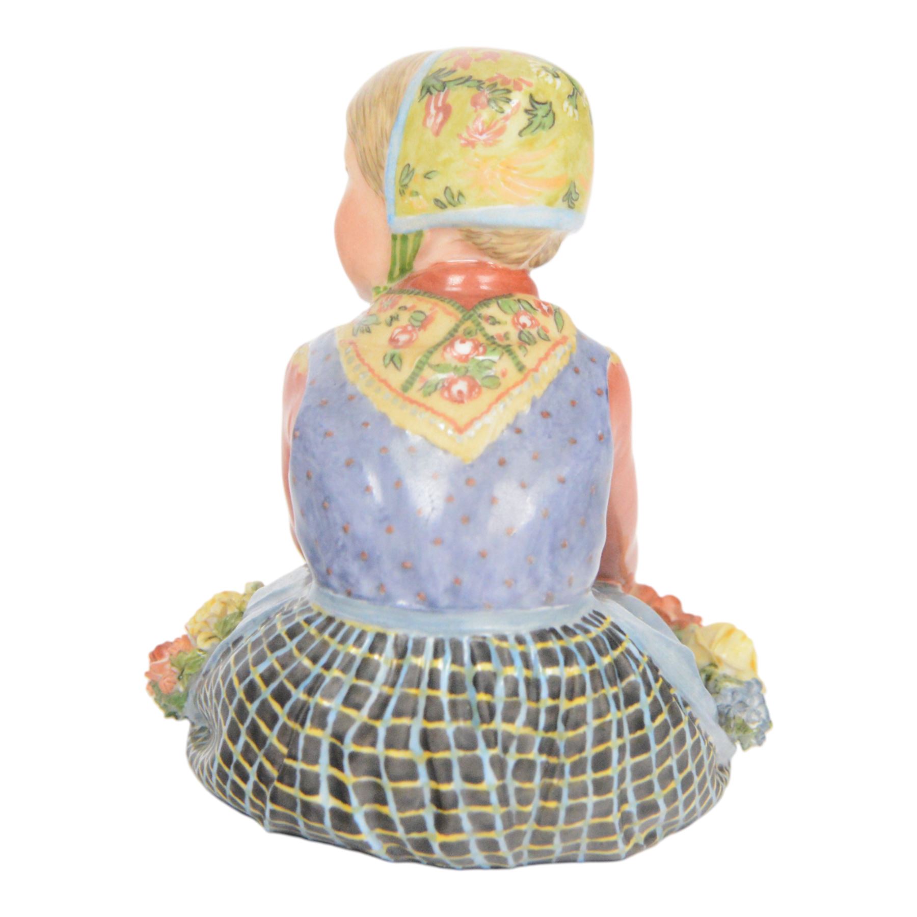 Royal Copenhagen figure, Jutland girl, designed by Carl Martin Hansen, from the Danish National Costumes series, of a girl with a flower garland, marked beneath, H8cm 