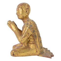 Late 19th century two Burmese Mandalay lacquered and gilt wood figures of monks, the robes edged with colored glass inlay and leafy scroll bands in raised lacquer, H25cm