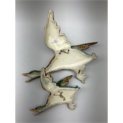 Two Royal Dux wall mounted ducks in flight, both with printed marks verso detailed Made In Czechoslovakia, and impressed marks, largest example L32.5cm, smallest example L21.5cm. 